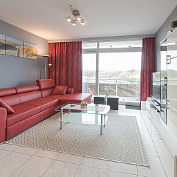 Stylishly furnished living room of Apartment Apt. 403 in Bredene, Belgium, with modern interior and coastal views.