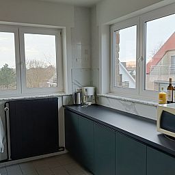 Modern kitchen in Papa's Dream vacation home, Oostduinkerke, overlooking the area in West Flanders.