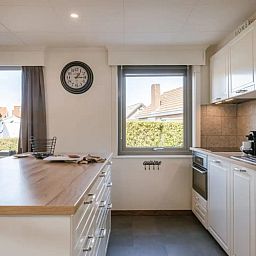 Bright kitchen area in Maison du coeur, vacation home in Oostduinkerke, West Flanders, with modern appliances.