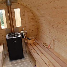 Die gemuetliche Sauna im Ferienhaus in Ronse, Ostflandern, Belgien, bietet Entspannung und Komfort fuer einen erholsamen Urlaub.
