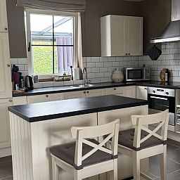 Modern kitchen in Holiday Home in Merksplas, Antwerp, Belgium, with stylish decor and lots of natural light.