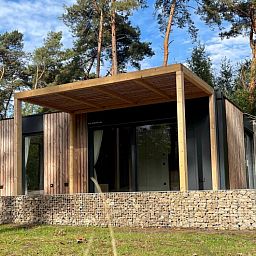 Detached house in 2400 Mol, a vacation home surrounded by nature in Mol, Antwerp, with a modern wooden veranda.