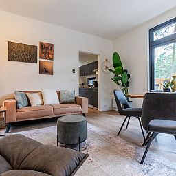 Cozy living room of the detached house in 2400 Mol, vacation home in Mol, Antwerp, Belgium with modern furnishings and views of nature.