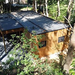 Vakantiehuisje in Retie, gelegen in de groene omgeving van Retie, Antwerpen, biedt een rustieke houten buitenkant met veel privacy.