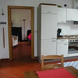 Cozy kitchen of Apartment Vue au Jardin in Hombourg, Ardennes, Belgium, with modern facilities and access to the cozy living room.