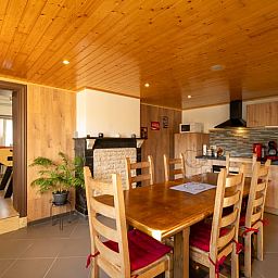 Spacious kitchen and dining room in Holiday cottage in Sivry, Hainaut, Belgium, ideal for cozy dinners with wooden interior.