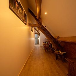 Cozy hallway with wooden beams in Holiday home in Sivry, Hainaut, Belgium, offers a warm and authentic atmosphere.
