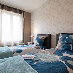 Gezellige slaapkamer in Vakantiehuis Memories, Le Bizet, Henegouwen, Belgie biedt comfort en rust in een charmante vakantiewoning.