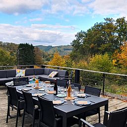 Enjoy the panoramic view from the terrace of chalet Agathe in Laforet, Ardennes, perfect for a relaxing vacation in nature.