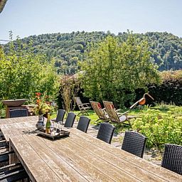 Leora Cosy vacation home in Membre, Ardennes, Belgium with sunny terrace and green surroundings for a relaxing stay.