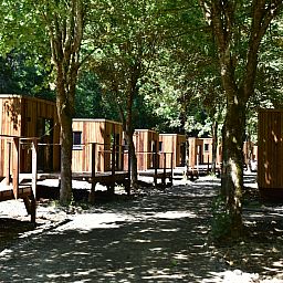 Ecolodge cottages surrounded by green nature in Houffalize, Ardennes, Belgium, ideal for a restful vacation.