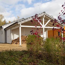 Cottage in Erezee, a charming cottage in the Ardennes, Luxembourg, Belgium, surrounded by nature and rustic autumn colors.