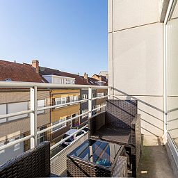 Enjoy the balcony of Apartment Zandloper in Bredene on the Belgian coast-the perfect spot for relaxing moments in a charming vacation home.