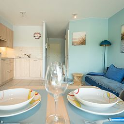 Cozy indoor space of Apartment Lautrec in Bredene on the Belgian coast, with modern kitchen and comfortable seating area.