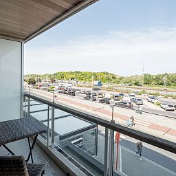 Enjoy the view from the balcony of Apartment Lautrec in Bredene on the Belgian coast, a comfortable vacation home.