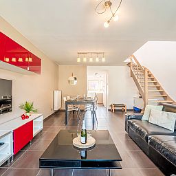 Stylish living room of Apartment Ter Duyne in Bredene, Belgian coast, with modern furnishings and comfortable seating area.