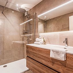 Luxury bathroom in Apartment 103, Bredene, Belgian coast, with modern shower and stylish sink for a comfortable stay.
