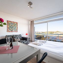 Apartment Studio 62-705 in Bredene, Belgian coast, offers a bright indoor space overlooking the dunes, ideal for a relaxing stay.