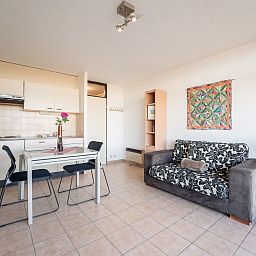 Cozy interior space of Apartment Studio 62-705 in Bredene, Belgian coast, with kitchen and comfortable sitting area.