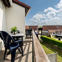 Enjoy the sunny balcony of Apartment Zeewind II A 11 in Bredene, Belgian coast, overlooking the peaceful surroundings.