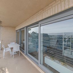 Enjoy the panoramic view from the spacious balcony of Apartment Solis in Bredene on the Belgian coast.