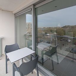 Enjoy the view from the terrace of Apartment Solis, a comfortable stay on the Belgian coast in Bredene.