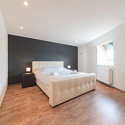 Stylish bedroom in Apartment Alaska Beach in Bredene, Belgian coast, offers comfort and tranquility for a relaxing stay.