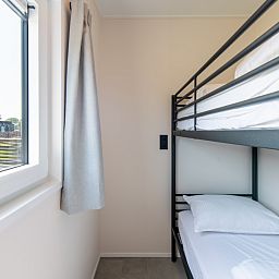 Slaapkamer met stapelbed in Wood Lodge, Nieuwpoort, Belgische kust. Comfortabel vakantiehuis voor 6 personen met airco.