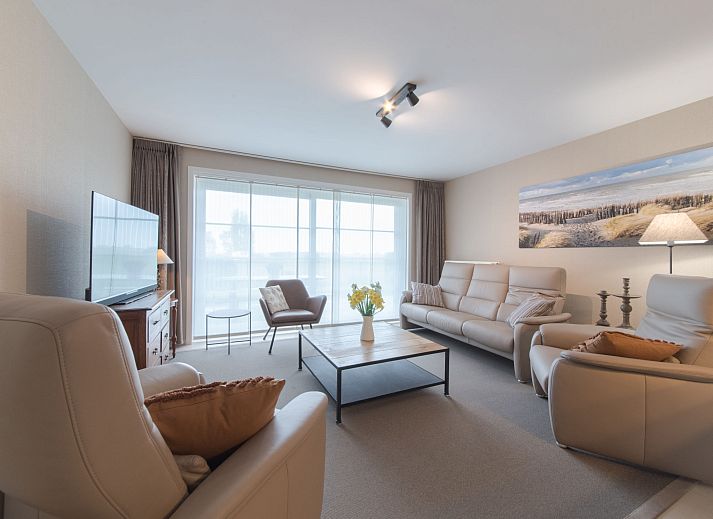 Geniessen Sie den sonnigen Garten des Ferienhauses Dagmar mit Parkplatz in De Haan, Westflandern, ideal fuer Entspannung in einem charmanten Ferienhaus.