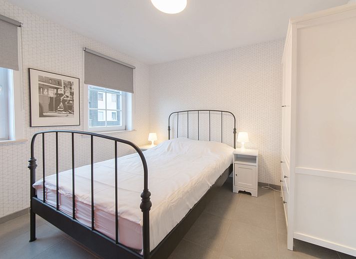 Gezellige woonkamer van Appartement Vosseslag I sunny in De Haan, West-Vlaanderen, met comfortabele zitruimte en veel natuurlijk licht.