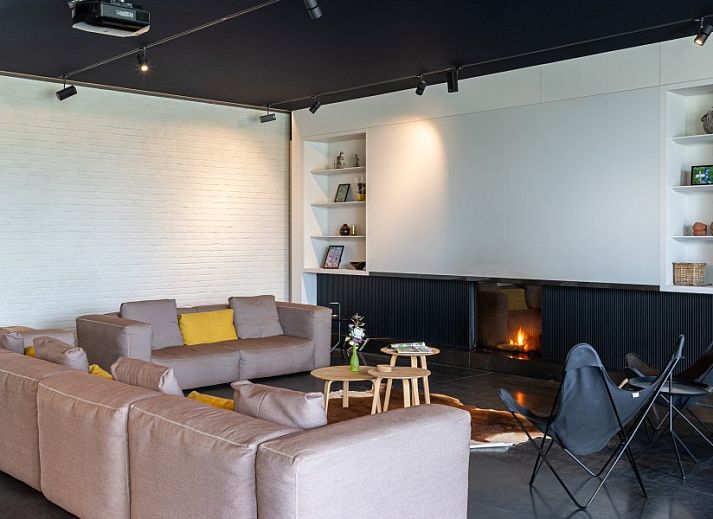 AKKERNEST vacation home in Heuvelland with colorful flower meadow and solar panels in West Flanders, Belgium.