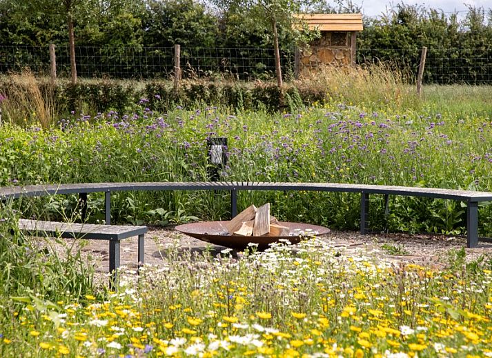 Stylish sitting area in AKKERNEST vacation home, Hill Country, with fireplace and modern furnishings.