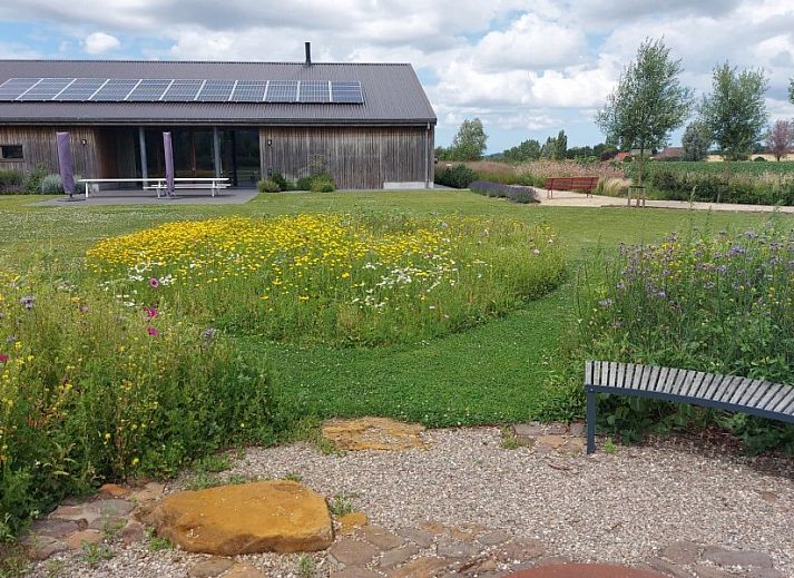 Stylish sitting area in AKKERNEST vacation home, Hill Country, with fireplace and modern furnishings.