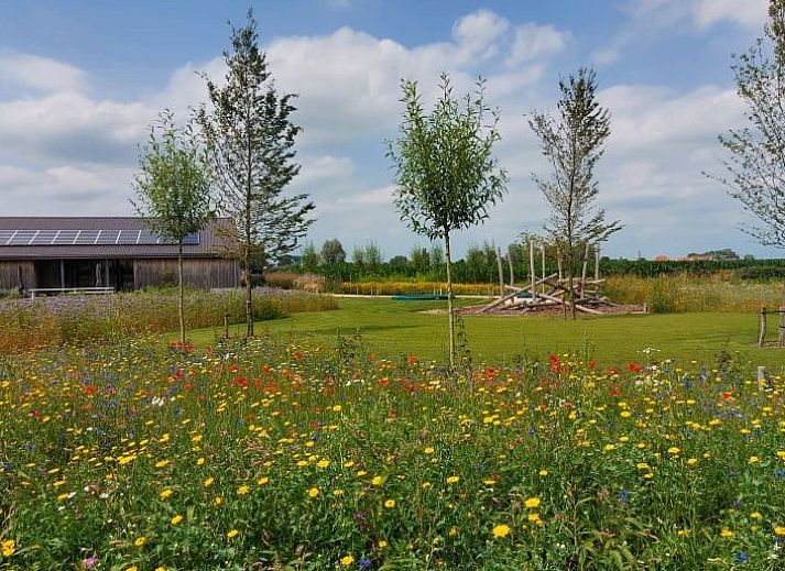 Modern kitchen in AKKERNEST vacation home, Hill Country, with spacious refrigerator and sleek storage.