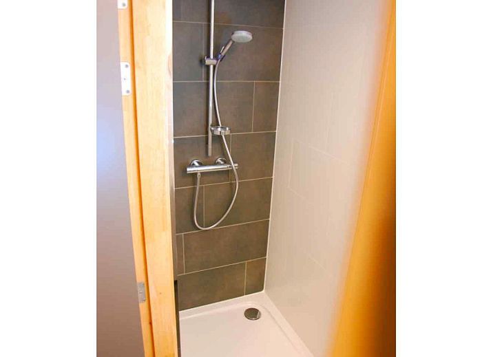 Modern kitchen in vacation home BK038, Koksijde, West Flanders, with stylish decor and garden view.