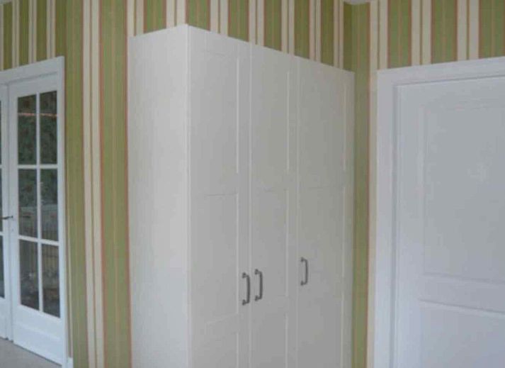 Modern kitchen in vacation home BK038, Koksijde, West Flanders, with stylish decor and garden view.