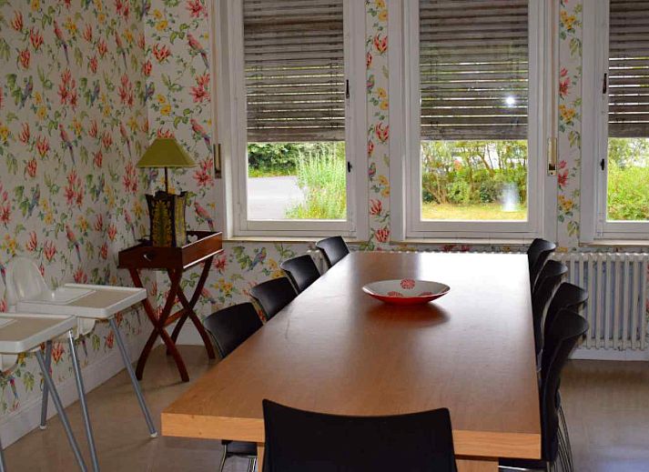 Cozy living room in vacation home BK038, Koksijde, West Flanders, with comfortable sitting area and warm furnishings.