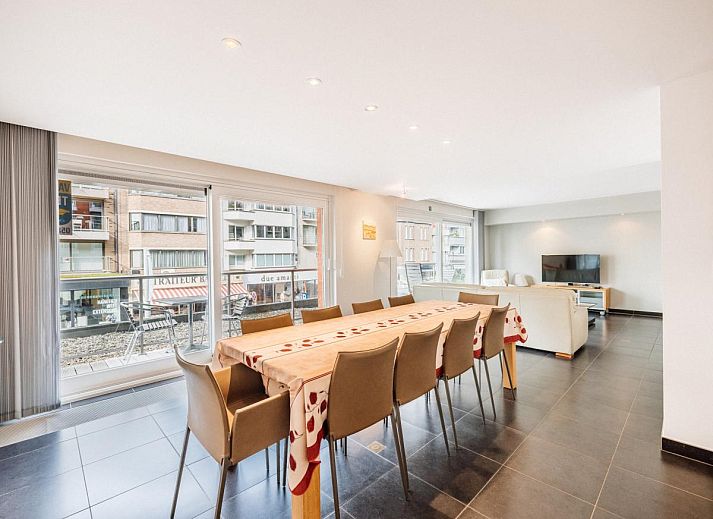 Spacious living room of Brit First vacation home in Koksijde, West Flanders, with modern furnishings and large windows for plenty of natural light.