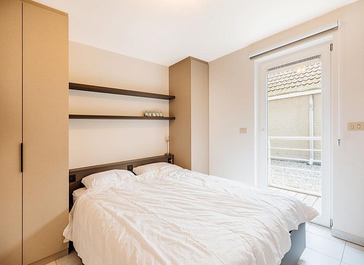Modern kitchen in Brit First vacation home, Koksijde, West Flanders, with sleek white cabinets and spacious countertops for a comfortable stay.