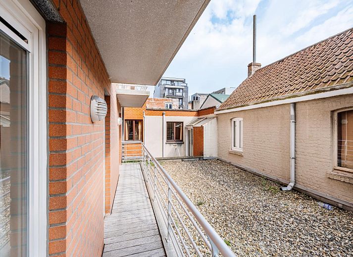 Modern kitchen in Brit First vacation home, Koksijde, West Flanders, with sleek white cabinets and spacious countertops for a comfortable stay.