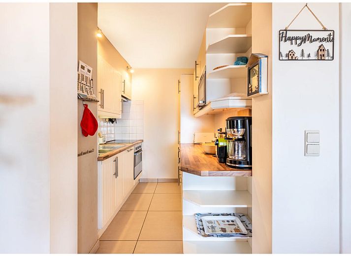 Gezellige woonkamer in vakantiehuis Cortina tweede, Koksijde, met prachtig uitzicht op het strand van West-Vlaanderen, Belgie.