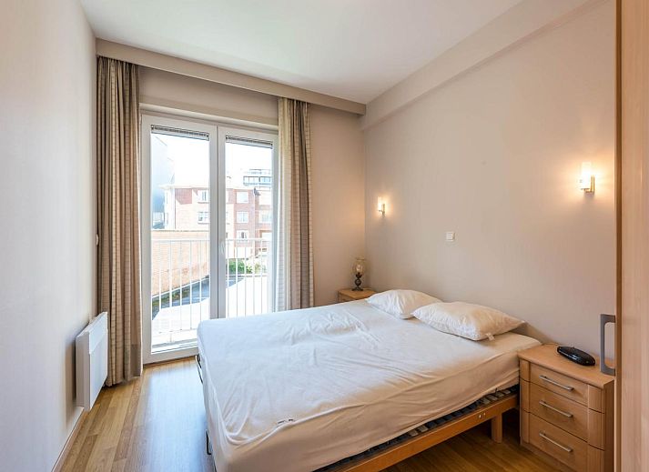 Uitzicht vanaf het balkon van Guernsey eerste vakantiehuis in Koksijde, West-Vlaanderen, met zicht op zee en strand.