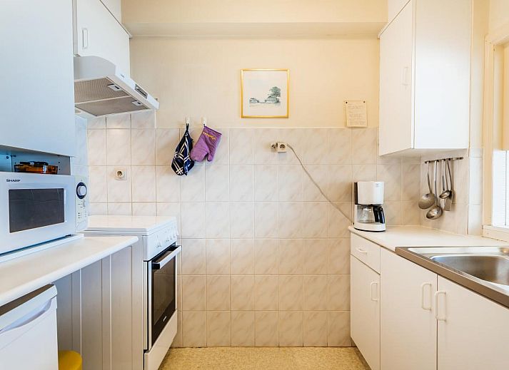 Ruime woonkamer van Courant du Golfe vakantiehuis in Koksijde, Belgie, met uitzicht op zee en gezellige zithoek.