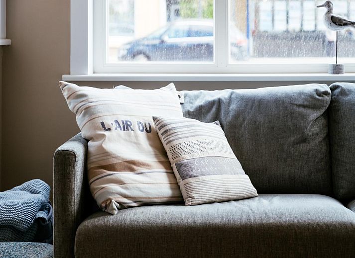 Stylish living room in vacation home Au Coin, Koksijde, West Flanders. Comfortable sitting area with lots of natural light and modern furnishings.