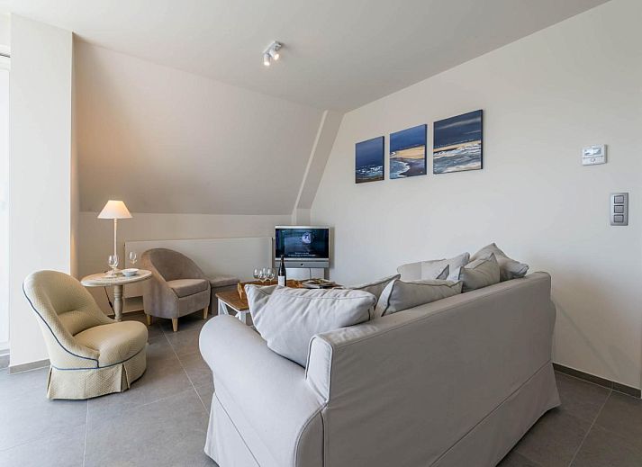 Geniet van het uitzicht vanaf het terras van Bon Accueil tweede vakantiehuis in Koksijde, West-Vlaanderen, met charmante daken in de omgeving.