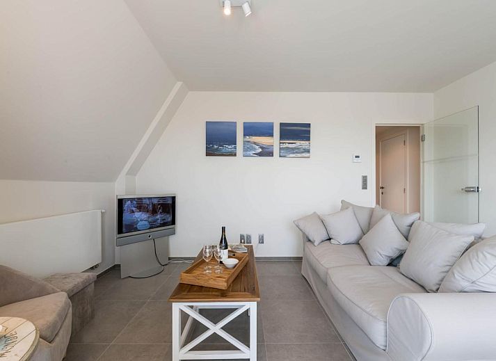 Geniet van het uitzicht vanaf het terras van Bon Accueil tweede vakantiehuis in Koksijde, West-Vlaanderen, met charmante daken in de omgeving.