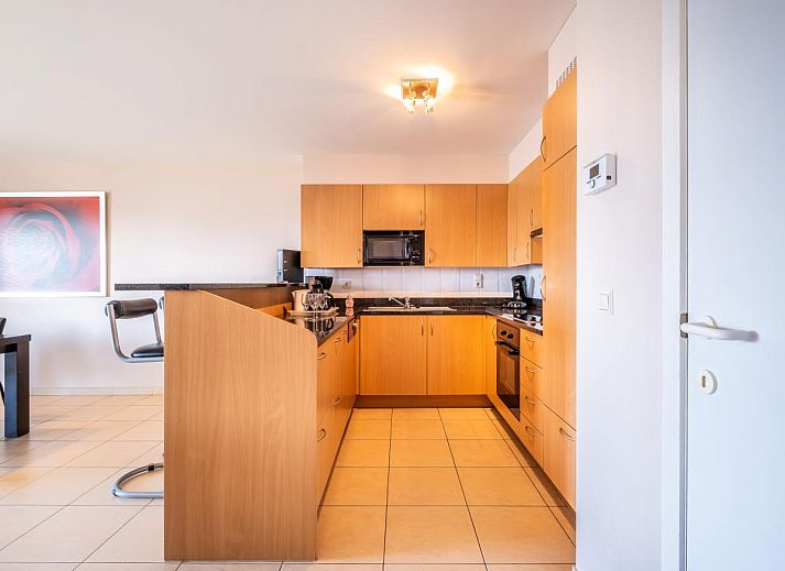 Gezellige woonkamer in Paco Vierde vakantiehuis, Koksijde, met moderne inrichting en comfortabele zitruimte in West-Vlaanderen, Belgie.