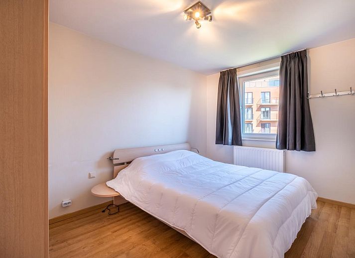 Gezellige woonkamer in Paco Vierde vakantiehuis, Koksijde, met moderne inrichting en comfortabele zitruimte in West-Vlaanderen, Belgie.