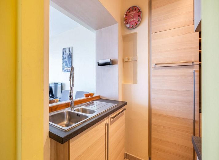 Vitelli vakantiehuis in Koksijde, West-Vlaanderen met uitzicht op duinen en strandpromenade, ideale plek voor een ontspannen strandvakantie.