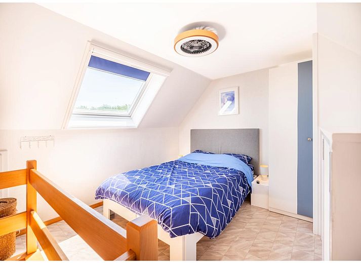 Veranda van Ardoise des dunes vakantiehuis in Koksijde, West-Vlaanderen, met prachtig uitzicht op groene omgeving.
